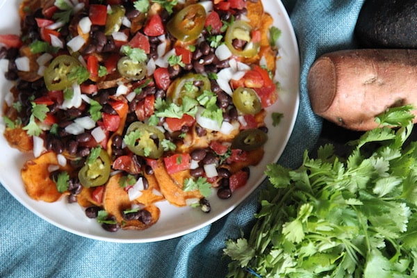 Sweet Potato Nachos - Vegan, Paleo, Gluten-Free - with black beans and avocado crema - recipe by Christy Brissette best healthy food blogger and media registered dietitian nutritionist and President of 80 Twenty Nutrition in Chicago