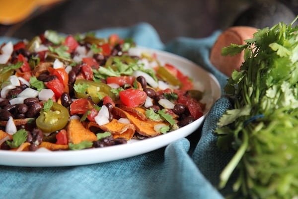 Sweet Potato Nachos - Vegan, Paleo, Gluten-Free - with black beans and avocado crema - recipe by Christy Brissette best healthy food blogger and media registered dietitian nutritionist and President of 80 Twenty Nutrition in Chicago