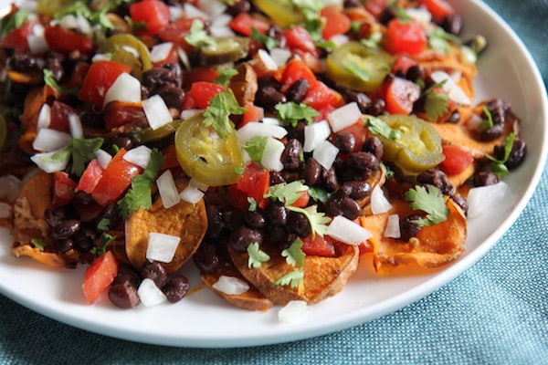 Sweet Potato Nachos - Vegan, Paleo, Gluten-Free - with black beans and avocado crema - recipe by Christy Brissette best healthy food blogger and media registered dietitian nutritionist and President of 80 Twenty Nutrition in Chicago