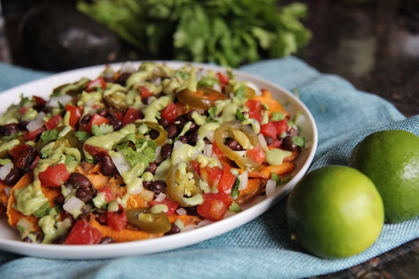 Sweet Potato Nachos - Vegan, Paleo, Gluten-Free - with black beans and avocado crema - recipe by Christy Brissette best healthy food blogger and media registered dietitian nutritionist and President of 80 Twenty Nutrition in Chicago
